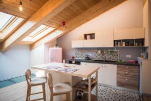 Kuchyň nebo kuchyňský kout v ubytování Loft 29 mansardato con ampio terrazzo