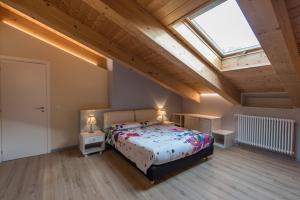 A bed or beds in a room at Loft 29 mansardato con ampio terrazzo
