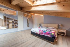 Postel nebo postele na pokoji v ubytování Loft 29 mansardato con ampio terrazzo