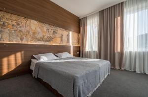 Giường trong phòng chung tại Hotel History • სასტუმრო ისტორია