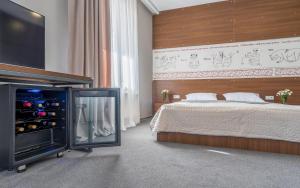 Postel nebo postele na pokoji v ubytování Hotel History • სასტუმრო ისტორია