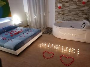 Postel nebo postele na pokoji v ubytování B&B La Perla & Suites