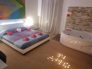 Postel nebo postele na pokoji v ubytování B&B La Perla & Suites