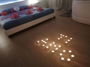 Postel nebo postele na pokoji v ubytování B&B La Perla & Suites