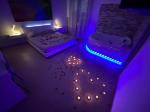 Postel nebo postele na pokoji v ubytování B&B La Perla & Suites