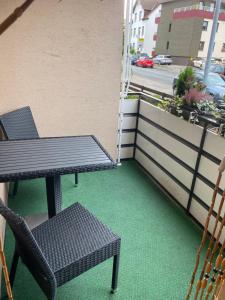 a patio with a table and chairs on a balcony at Forsternest in Hameln