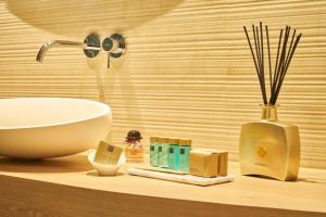 a bathroom counter with a white bowl and a sink at Classic Hotel Harmonie in Cologne