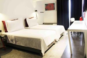 Katil atau katil-katil dalam bilik di BTH Hotel – Boutique Concept