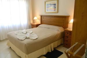 Una cama o camas en una habitación de Sesma Excelencia en Cabañas