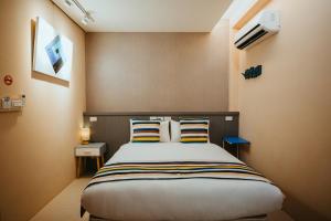 Giường trong phòng chung tại Pingan Ju Homestay