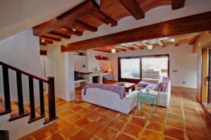 a living room with a white couch and a table at Finca Argudo - private pool villa in Moraira in Moraira +25 photos