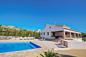 a villa with a swimming pool and a house at Finca Argudo - private pool villa in Moraira in Moraira