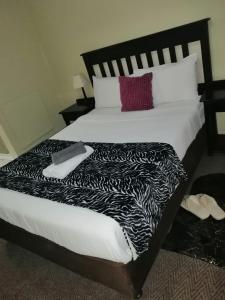 מיטה או מיטות בחדר ב-zig zag self catering accommodation