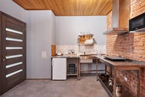 a kitchen with a counter and a sink in a room at New Historical Museum Apartment in Kharkiv