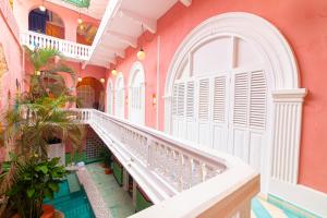 a corridor of a building with a balcony at CASA MOVIDA HOSTEL in Cartagena de Indias