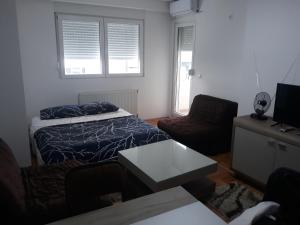 Lova arba lovos apgyvendinimo įstaigoje Apartman Vranje