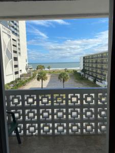 a view of the beach from the balcony of a building at The Atlantic in Myrtle Beach
