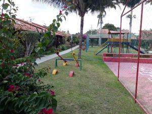 a park with a playground with a swing at Chalé aconchegante na Serra Pernambucana - Em condomínio - Gravatá in Gravatá