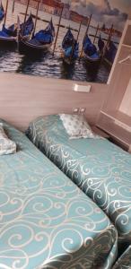 Postel nebo postele na pokoji v ubytování Hotel Altieri