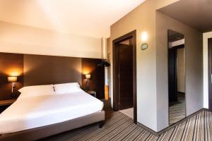 Postel nebo postele na pokoji v ubytování Sweet Hotel
