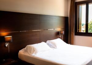 Postel nebo postele na pokoji v ubytování Sweet Hotel