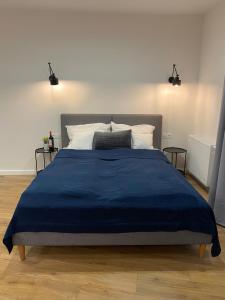 
Łóżko lub łóżka w pokoju w obiekcie Cymes Apartment
