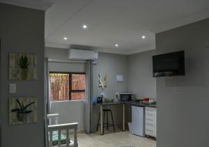 a kitchen with a sink and a counter top at Biki Plek 2 in Kimberley