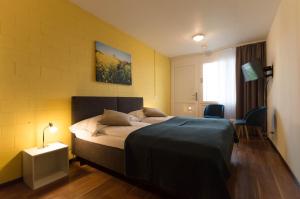 Ένα ή περισσότερα κρεβάτια σε δωμάτιο στο Hotel Bodensee-Arena