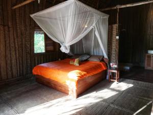 Postel nebo postele na pokoji v ubytování COCO REEF ECOLODGE