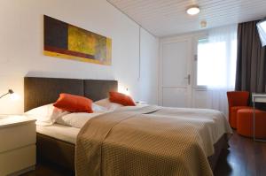 Ένα ή περισσότερα κρεβάτια σε δωμάτιο στο Hotel Bodensee-Arena