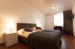 Ένα ή περισσότερα κρεβάτια σε δωμάτιο στο Hotel Bodensee-Arena