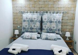 Postel nebo postele na pokoji v ubytování O'Paisi Casa Vacanze