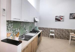 Kuchyň nebo kuchyňský kout v ubytování O'Paisi Casa Vacanze