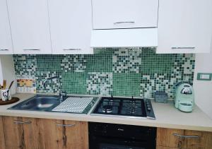 Kuchyň nebo kuchyňský kout v ubytování O'Paisi Casa Vacanze