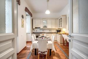 a kitchen with a table and chairs in a room at Residenza Italia in Rome