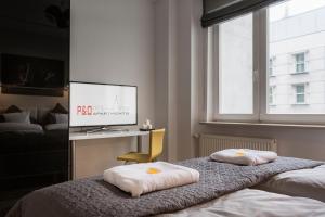 Postel nebo postele na pokoji v ubytování P&O City Center Apartments