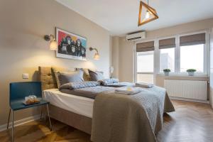Postel nebo postele na pokoji v ubytování P&O City Center Apartments