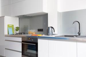 Kuchyň nebo kuchyňský kout v ubytování P&O City Center Apartments