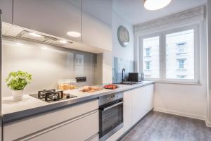 Kuchyň nebo kuchyňský kout v ubytování P&O City Center Apartments