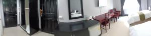 Postel nebo postele na pokoji v ubytování Submukda Phoomplace Hotel