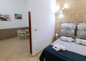 Postel nebo postele na pokoji v ubytování O'Paisi Casa Vacanze