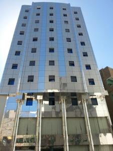 a tall building with a lot of windows at Al Aseel Ajyad in Makkah