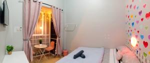 Postel nebo postele na pokoji v ubytování Ministry Homestay
