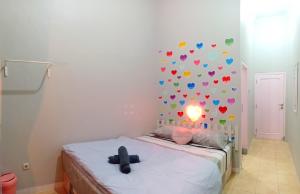 Postel nebo postele na pokoji v ubytování Ministry Homestay