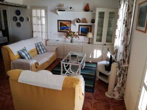 a living room with a couch and a table at Casa Pilar in Perelló