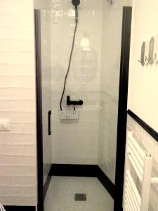 a shower with a glass door in a bathroom at Casa Eladia in Logroño +26 photos