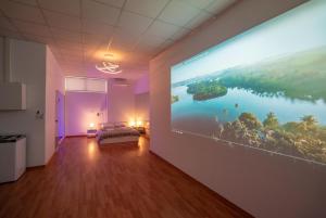 A television and/or entertainment centre at Cinema Zeus Studios - by Avelink