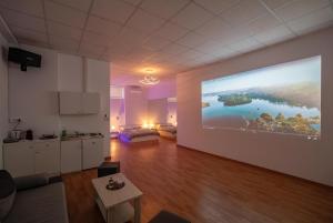 A television and/or entertainment centre at Cinema Zeus Studios - by Avelink