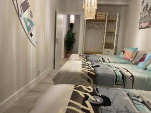 A bed or beds in a room at Enjoy Ávila -LA CATEDRAL