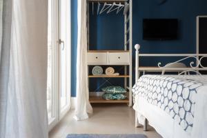 Postel nebo postele na pokoji v ubytování B&b Don Giovanni